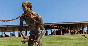A sculpture of an enslaved man by Kwame Akoto-Bamfo at the National Memorial for Peace and Justice.