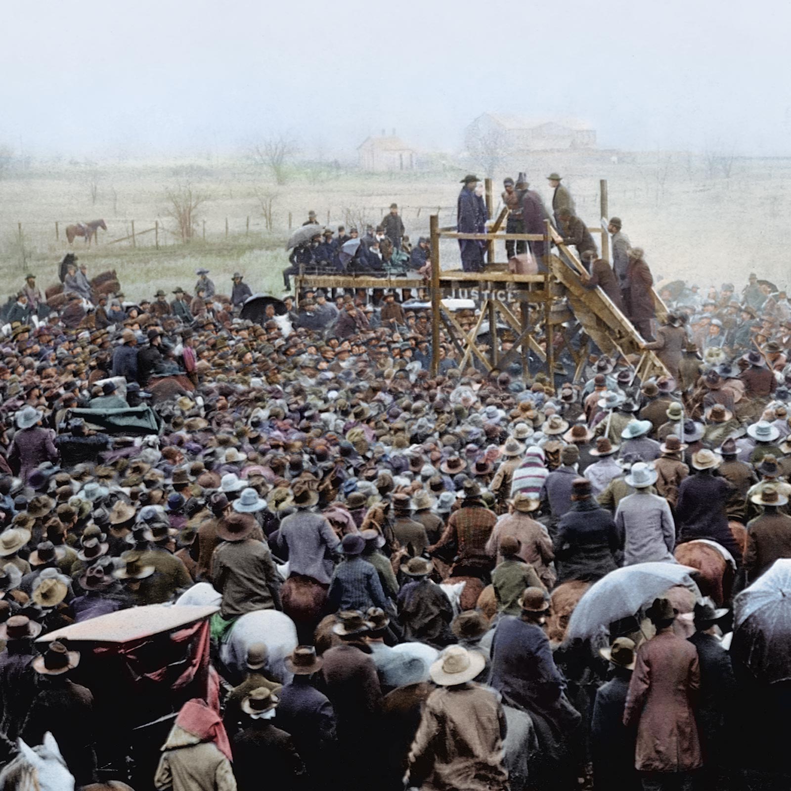 Colorized photograph shows thousands of people watching the public spectacle lynching of Henry Smith in Paris, Texas, on February 1, 1893.