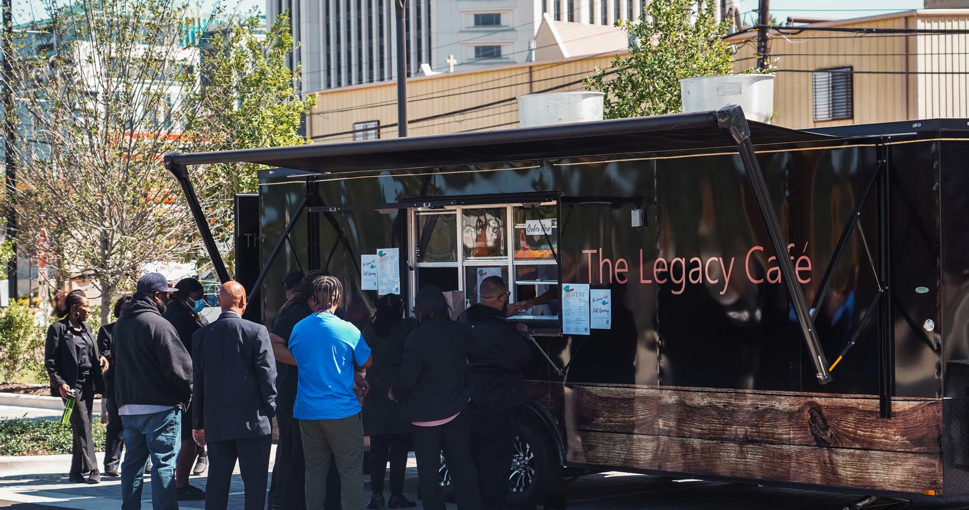 Visitors order a quick lunch from the Legacy Cafe, EJI's food truck located in Legacy Plaza, across the street from the museum.